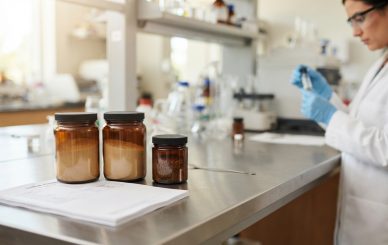 Natural plant and mushroom extract powder samples with ingredient documents for pet supplement sourcing.